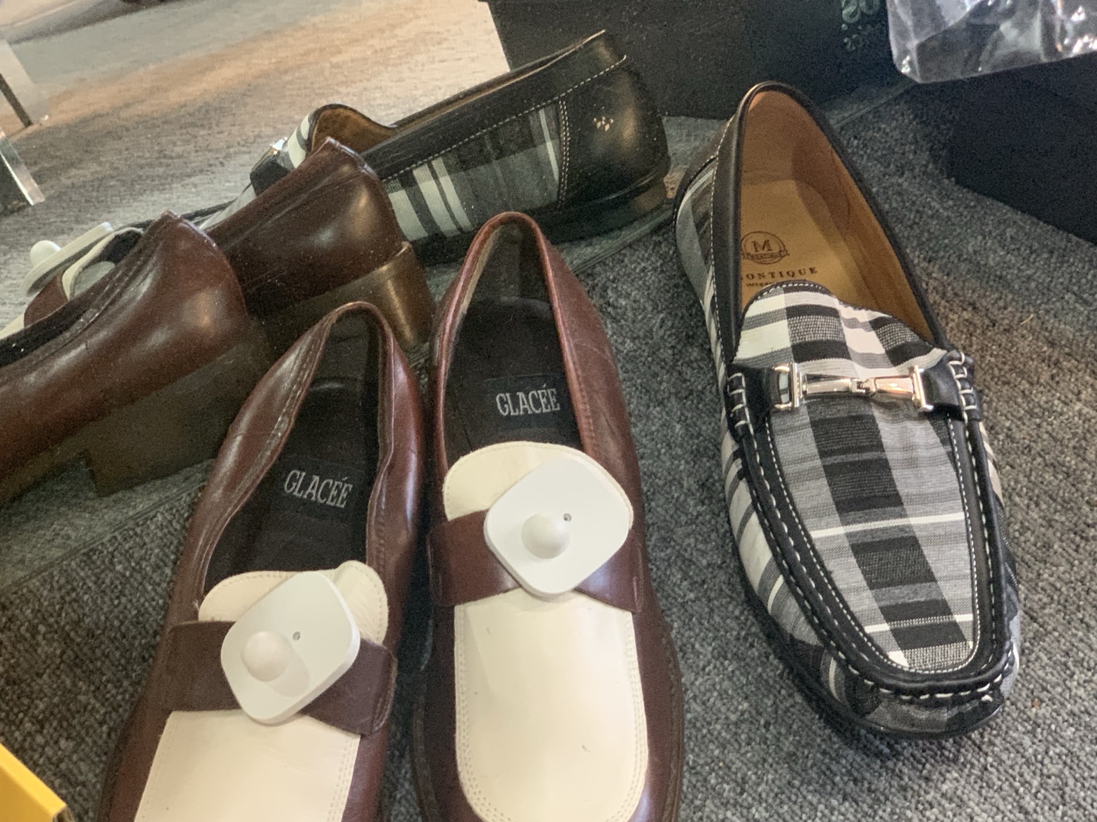 Burgundy-and-cream and checked loafers on display