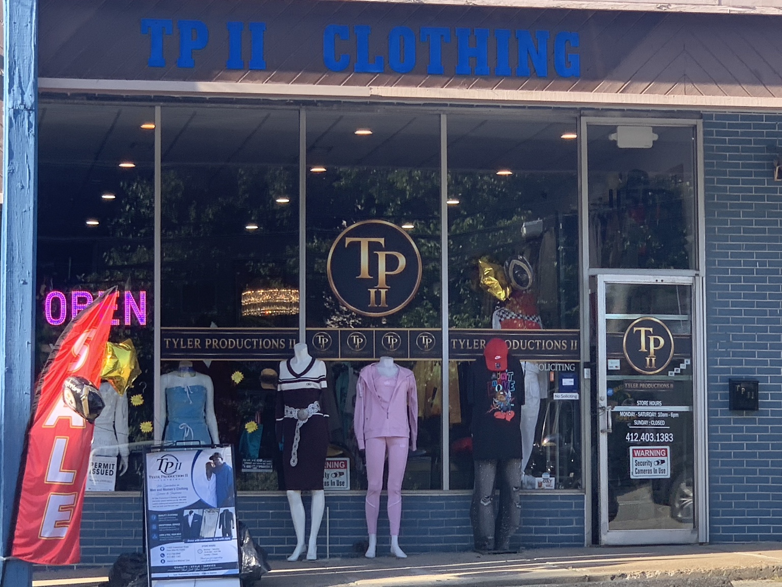 Tyler Production II Clothing storefront with the blue TP II Clothing sign and entrance