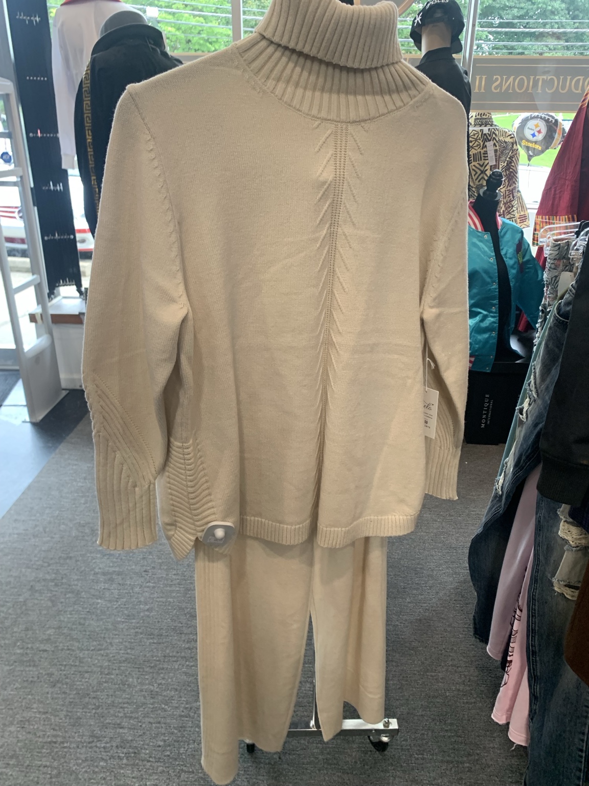 Cream turtleneck knit top with matching wide-leg trousers